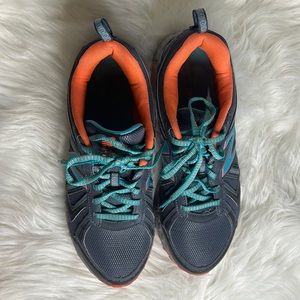 New Balance women’s tennis shoes, worms few times, lightly used.  Size 11